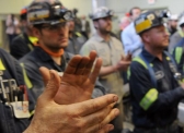 Coal miners applaud U.S. EPA Administrator Scott Pruitt as he addresses those April 13 at Harvey Mine in Sycamore, PA.