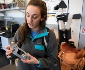 Colorado School of Mines mechanical engineering student Megan Auger holds an aluminum prosthetic dancing foot.