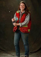 Tara Hutchison poses for a photo with her geologist's hammer, circa 2013, at the Pogo Mine.