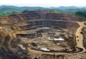 Excavators and drillers at work in an open pit copper and cobalt mine in the DRC.