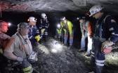 Mine-safety officials speak with workers at the Gibson North mine in Princeton, Ind., in 2015.