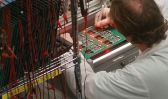 A printed circuit board is checked after assembly at Industrial Scientific Corp. (Photo: Larry Roberts/Post-Gazette)