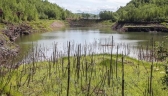 Redhead Mountain Bike Park in Chisholm offer dramatic views of mine pits such as this view seen from the trail Fractured Falls.