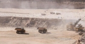 Photo taken on May 11, 2018 shows haul trucks working at Husab Uranium Mine in western Namibia.