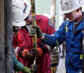 Precision Drilling operators work on a rig near Mentone, Texas in 2017.