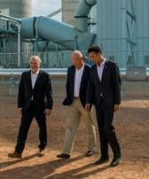 Paul Kukut, Gov. Matt Mead and Marcius Extavour, walk across the Integrated Test Center grounds before the facility's dedication
