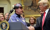 President Donald Trump shakes hands with coal miner Michael Nelson at the White House in Washington, D.C., February 16, 2017.
