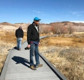 Len Warren and John Zablocki from the The Nature Conservancy stand on the boardwalk at the Torrance Ranch Preserve.