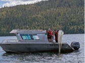 Researchers from the University of Northern British Columbia use a net to collect plankton for metal analysis from Quesnel Lake.