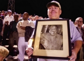 James Walker Hammond, holding a photo of John Lewis, a founding member of the United Mine Workers of America.