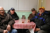 Retired Kemmerer coal miners Mark Bartlett, Joe Fagnant, Kim McKee and Dave Hunzie sit at Rosie's bar on Feb. 11.