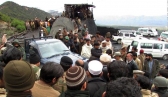 Pakistani security personnel and rescuers gather at the site of a coalmine collapse pn March 13, 2016.