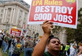 Members of the UMWA America hold a rally outside the U.S. Environmental Protection Agency headquarters on October 7, 2014.