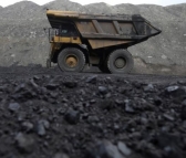 Dump trucks haul coal and sediment at the Black Butte coal mine outside Rock Springs, Wyoming, U.S.
