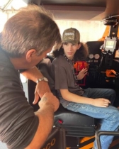 John Meadows instructs Joe Roberts in the operation of a Shuttle Car at the Bluefield Coal & Mining Show