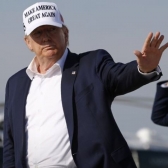 President Donald Trump waves as he steps off Air Force One at Andrews Air Force Base, Md., Sunday, July 26, 2020.