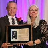 James Walsh professor of politcal science at University of Colorado accepts for Mary Harris
