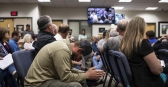Craig Wakefield, an employee at Belle Ayr Miner for 10 and a half years, listens to officials talk during a meeting.