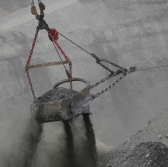 The bucket of a dragline excavator moves earth while mining coal at the Peabody Energy Somerville Central strip mine.