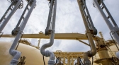 Liquefied natural gas (LNG) dispenses through pipes on-board the Gallina LNG tanker.