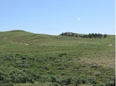 Land reclaimed using geomorphic techniques blends in with undisturbed terrain in the Gas Hills of Fremont County.