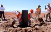 Workers prepare to install a moisture metering system in the middle of Atacama salt flat near Toconao in San Pedro de Atacama.