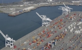 The former Oakland Army Base pier, at left, and the Port of Oakland, at lower right, in Oakland, Calif.