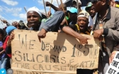 Striking miners in Carletonville in 2012 highlight the plight of workers with silicosis.(photo: Alexander Joe, AFP)