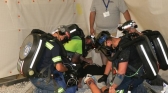 Hamilton County Coal Mine Rescue team accesses the injuries of a fallen miner in the mine simulation facility.
